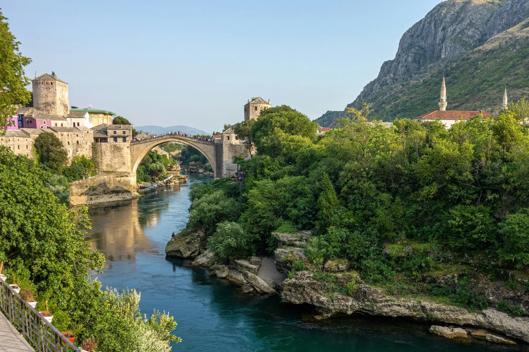 The Stari Most Ottoman bridge arching over the green Neretva river in Mostar, Bosnia and Herzegovina