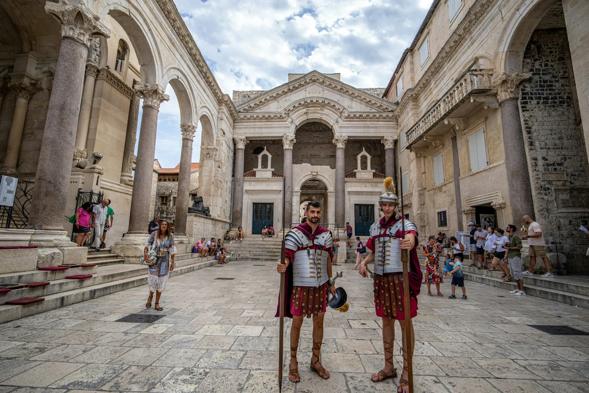 Costumed Roman legionaries standing in the colonnaded Peristyle courtyard at the heart of Diocletian's Palace, Split