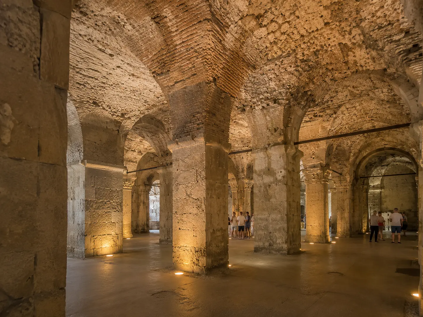 Stone arches and vaulted underground chambers in the cellars of Diocletian's Palace, Split